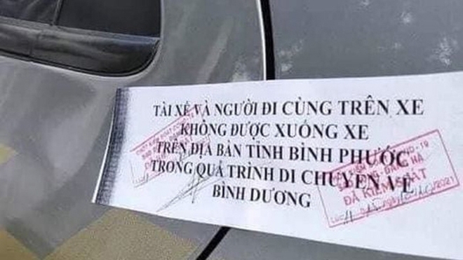 Ô tô bị niêm phong cửa, cấm xuống tại Bình Phước: Trên xe có người đang hấp hối. Chùm Covid-19 ở Hà Nam đã tăng lên 721 ca nhiễm - Ảnh 3.