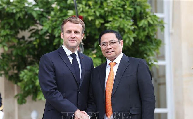 Tổng thống Pháp Emmanuel Macron và Thủ tướng Phạm Minh Chính. Ảnh: Dương Giang/TTXVN