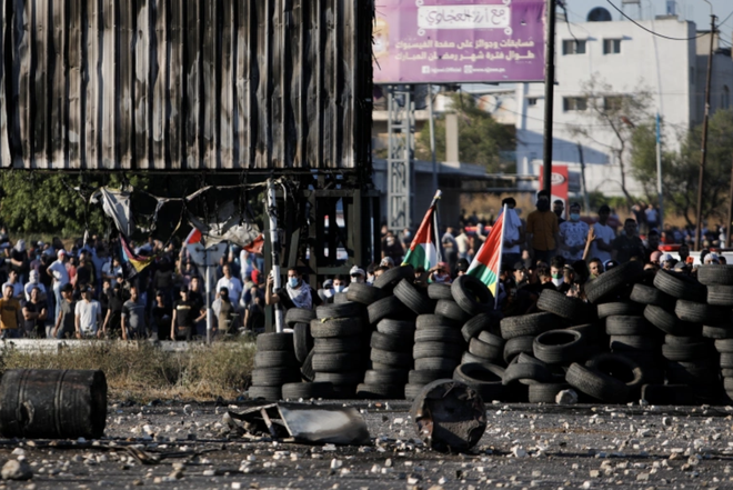 Israel mở 60 cuộc không kích Gaza, Hamas nhắm rocket vào căn cứ IAF - Ảnh 6.