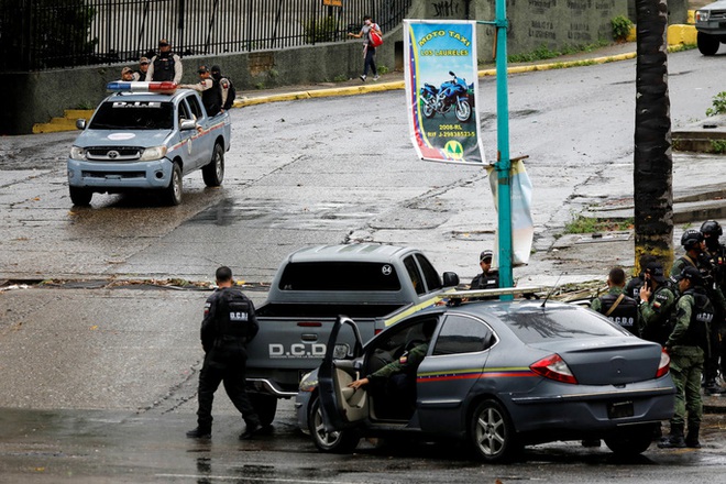 Venezuela: Cảnh sát giao tranh với băng đảng, hàng chục người thương vong - Ảnh 1.