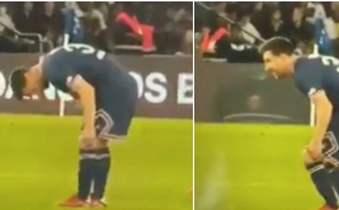Messi cúi xuống kiểm tra đầu gối trái trong trận PSG gặp Lyon