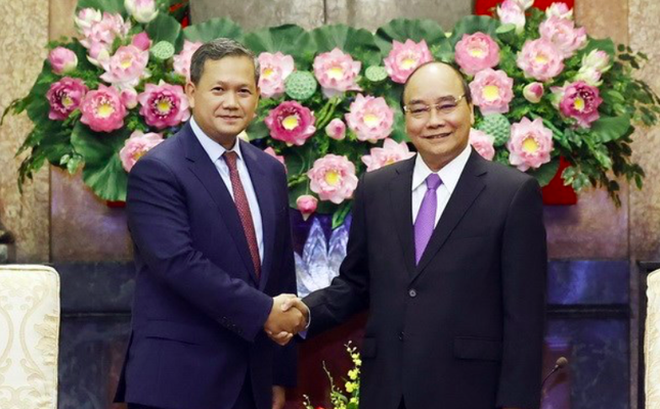 Chủ tịch nước Nguyễn Xuân Phúc tiếp Đại tướng Hun Manet. (Ảnh: TTXVN)