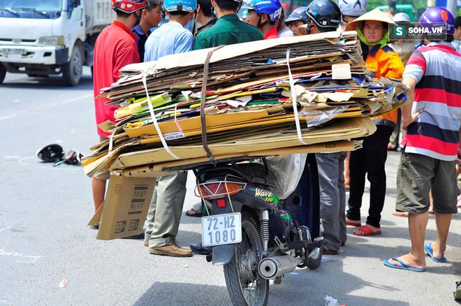 Né xe chở phế liệu, nam thanh niên va chạm xe tải bị cán tử vong - Ảnh 1.