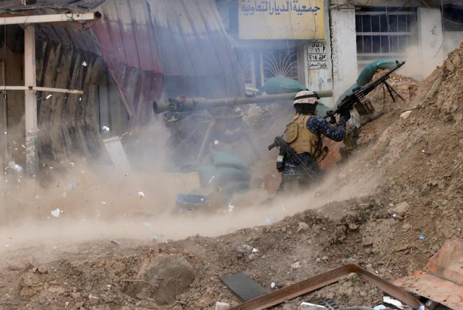 24h qua ảnh: Cảnh sát Iraq nã mưa đạn vào phiến quân IS - Ảnh 4.