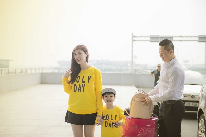 Hoa hậu Phí Thùy Linh và con trai mặc nổi bật tại sân bay - Ảnh 2.