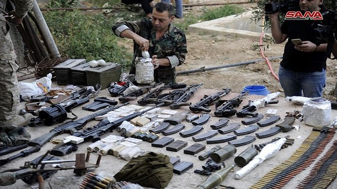 Quân đội Syria chiếm kho vũ khí bí mật của phiến quân Al-Qaeda gần Damascus - Ảnh 1.