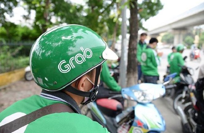 Grab tăng giá cước sau khi thâu tóm Uber  - Ảnh 1.