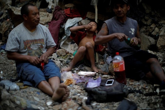 Cuộc sống cơ cực của những người chuyên đi bới rác ở Guatemala - Ảnh 7.