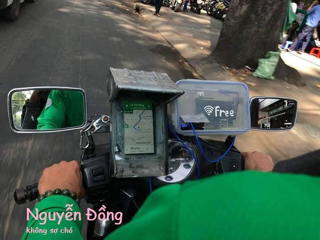 Dịch vụ chuẩn 5 sao của bác tài GrabBike: Wifi miễn phí, kẹo ăn mệt nghỉ, có túi bỏ vỏ cho đỡ hại môi trường - Ảnh 2.