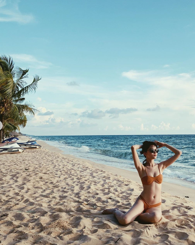 Diện bikini, Á hậu Thùy Dung khoe body nóng bỏng cùng chân dài thẳng tắp - Ảnh 2.