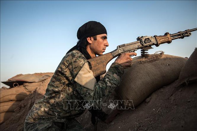 Các lực lượng người Kurd ở Syria bắt đầu rút khỏi biên giới Thổ Nhĩ Kỳ - Ảnh 1.