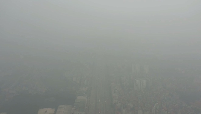 Nhiều tòa nhà mờ ảo nhìn từ flycam, chất lượng không khí ở Hà Nội suy giảm - Ảnh 7.