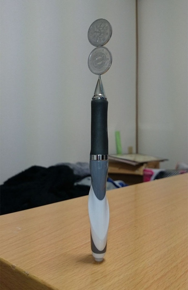 Kỹ năng xếp tiền xu thách thức trọng lực của chàng trai Nhật Bản - Ảnh 11.