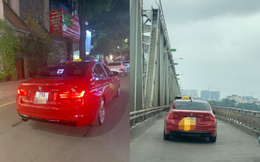 BMW tiền tỉ gắn biển taxi chạy trên phố Hà Nội khiến người đi đường xôn xao, chụp ảnh đăng lên MXH