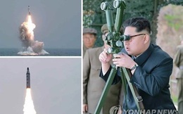 [ẢNH] Ông Kim Jong-un theo dõi phóng tên lửa từ tàu ngầm