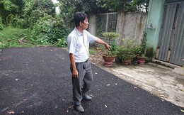 Bỏ tiền túi làm đường, người đàn ông bị còng tay: 'Có hành vi chống người thi hành công vụ'