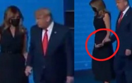 Tái xuất sau khi mắc Covid-19, Đệ Nhất Phu nhân Mỹ Melania Trump gây chú ý khi có hành động “giằng co” với chồng ngay trên sân khấu