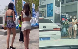 Ô tô rồng rắn xếp hàng vào cây xăng người mẫu mặc bikini phục vụ