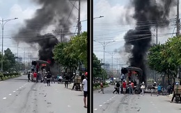 Xe tải cháy ngùn ngụt, hàng chục người dân giúp tài xế "giật hàng" khỏi tay bà hỏa