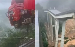 Trung Quốc: Mưa lũ gây sập cầu, tài xế container mắc kẹt trên miệng vực sâu 100m