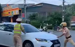 Nữ tài xế ô tô Lexus khóa cửa, tăng ga bỏ chạy khi CSGT dừng xe