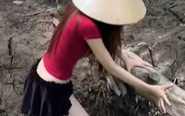 Mặc váy ngắn đi mò ốc, hot girl hút hơn 3 triệu view chỉ trong nháy mắt