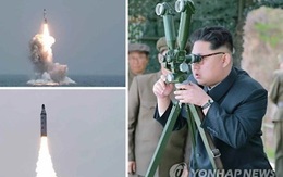 [ẢNH] Ông Kim Jong-un theo dõi phóng tên lửa từ tàu ngầm