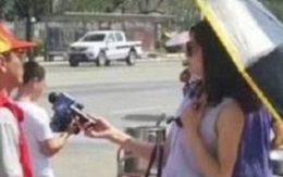 Nữ phóng viên Trung Quốc bị đình chỉ vì đeo kính râm, cầm ô che nắng trong lúc tác nghiệp