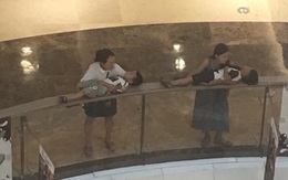 Shopping chán chê, 2 bà mẹ trẻ hồn nhiên đặt con nhỏ đang say ngủ lên lan can trung tâm thương mại để nghỉ ngơi