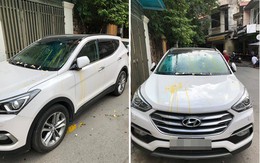 Đỗ thiếu ý thức, xe ô tô trắng bị ném trứng sống trên phố Hà Nội?