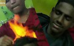 Video: Cắt tóc bằng lửa - phương pháp làm đẹp 'gây sốc' của người Ấn Độ