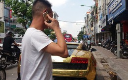 Hà Nội: Lamborghini bạc tỷ bốc khói nghi ngút giữa phố, người dân hiếu kỳ vây quanh