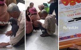 Bức ảnh người cha già ngồi bệt giữa sân trường nâng niu giấy khen tốt nghiệp loại giỏi của con gái khiến dân mạng xót xa