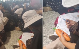 Đi đón thần tượng dự AAA nhưng chợt nhớ sắp phải thi IELTS, nữ sinh mang sách vở ra luyện đề ngay tại sân bay Nội Bài