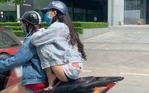 Cô gái ngồi xe máy chẳng thà làm hành động nguy hiểm chứ nhất quyết không để cặp đùi bị cháy nắng khiến dân mạng "ném đá" không thương tiếc