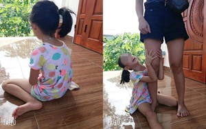Bé gái khóc nức nở, ôm chặt chân không cho mẹ bắt mèo, tấm ảnh cuối khiến tất cả vừa thương vừa buồn cười