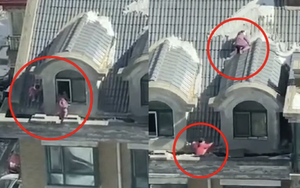 Hai bé gái sinh đôi thản nhiên chơi "cầu trượt" trên mái nhà, cảnh tượng "đối mặt với tử thần" khiến người dân thót tim