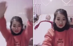 Quay TikTok nhảy múa bên cạnh chồng nằm liệt giường, người phụ nữ khiến dân mạng chia phe tranh cãi