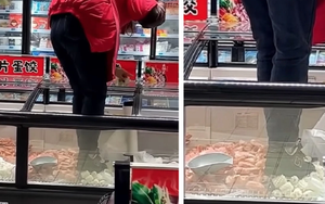 Nữ nhân viên ở siêu thị Trung Quốc khiến dân mạng phẫn nộ vì trèo cả giày vào tủ đông, đạp lên thực phẩm chỉ để dán tờ quảng cáo