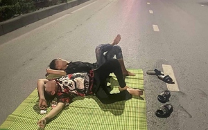 Công an triệu tập hai thanh niên trải chiếu nằm giữa Quốc lộ 18 để "câu like"