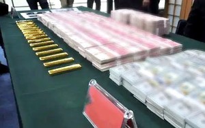 Kiểm tra nhà người phụ nữ 57 tuổi, phát hiện hơn 35 tỷ đồng tiền mặt và 16 kg vàng