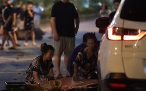 Cảnh tượng xé lòng: Người vợ trẻ ngã quỵ bên thi thể chồng sau vụ ô tô tông liên hoàn ở Hà Nội