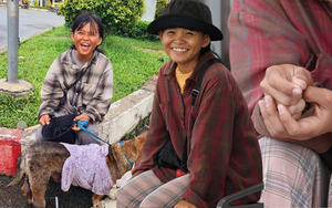 Câu chuyện sau bức ảnh cô bé ăn xin ôm chú chó già ở ngã tư Hàng Xanh