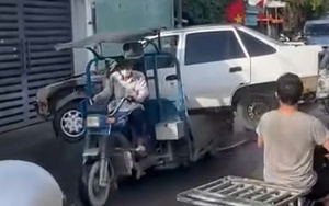 Thông tin mới vụ xe ba gác "cõng" ô tô gây bức xúc ở TP HCM