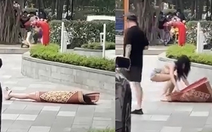 Clip hot girl có hành động khó hiểu, nằm đắp chiếu giữa sảnh chung cư đông người