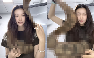 Cô gái thản nhiên quấn "con rắn" khổng lồ quanh người lên máy bay, hành khách xôn xao khi biết đó là gì