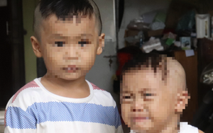 Hai trẻ nhỏ ướt đẫm trong mưa vì bị bỏ rơi trước cổng chùa