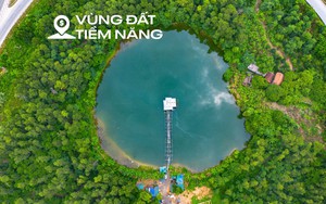 Ngắm nút giao vừa có hồ nước, rừng cây xanh và nhà dân trên đại lộ dài nhất Việt Nam