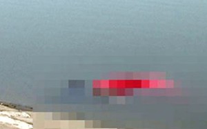 Tìm thân nhân thi thể phụ nữ mặc váy đỏ nổi trên hồ Trung Văn