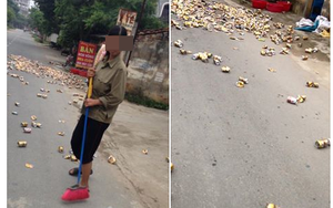 Lạ đời chuyện người phụ nữ xả hàng trăm lon bia ra... đường